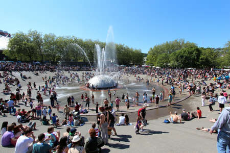 Cooling off in the International Fountain, Seattle Centre. Northwest Folklife Festival, Memorial Day Weekend 2012.のeditorial素材