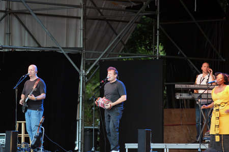 SEATTLE â AUGUST 5: South African Johnny Clegg and the Johnny Clegg Band performs in the Woodland Park Zoo, Seattle 5 August 2012のeditorial素材