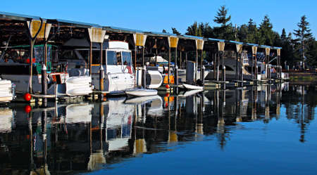 Reflections of boats in a marinaの写真素材
