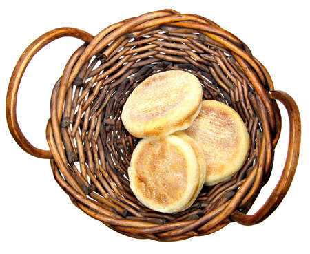 English muffins in a basket isolate on whiteの写真素材