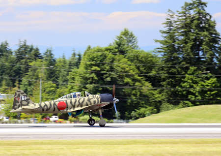EVERETT -  JUNE 29  A restored World War Mitsubishi A6M3-22 Reisen Zero was seeing flying in the skies over Everett Paine Field on 29 June 2013 near Seattle, WA のeditorial素材