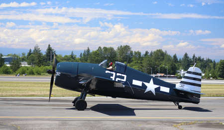 EVERETT -  JUNE 29  A restored World War 2 Grumman F6F-5 Hellcat was seeing flying in the skies over Everett Paine Field on 29 June 2013 near Seattle, WA のeditorial素材