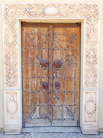An old wooden door with hardware attachedのeditorial素材