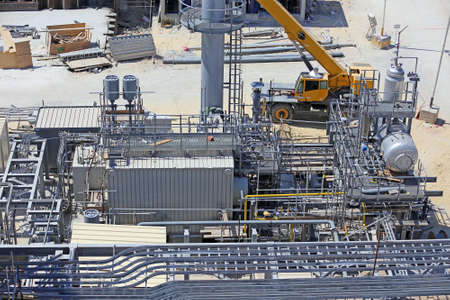 Industrial construction of a power plant showing a package boiler for auxiliary steam