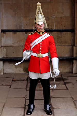 LONDON - Oct 12  Horse Guard with traditional armour, on Oct 12, 2013 in London, Englandのeditorial素材