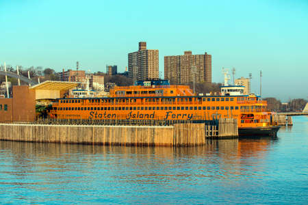 STATEN ISLAND, USA, APRIL 19, 2015: Dawn sunlight reflecting off the Staten Island Ferry, a free ferry service between St. George on Staten Island and Whitehall Street in lower Manhattanのeditorial素材