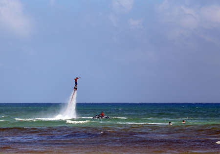 Flyboarding using a jetskiの写真素材
