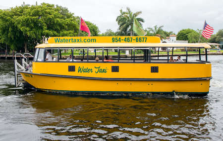 Fort Lauderdale, FL, USA - LAUDERDALE - June 22, 2016: Tourists enjoy a trip along Fort Lauderdale's waterways aboard a water taxi.のeditorial素材