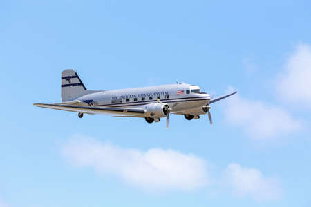 Everett, WA, USA - July 30, 2016: A vintage DC-3 was seen flying over Everett Paine Fieldの写真素材