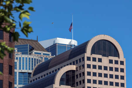 Modern city buildings architectural rooflines with an American Flagのeditorial素材