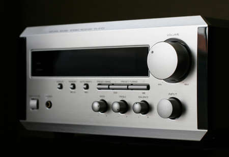 Silver Audio Receiver on black backgroundの写真素材