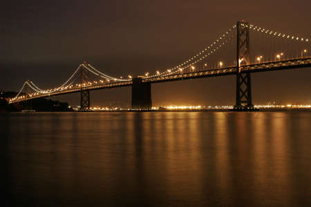 Bay Bridge illuminated at night, San Francisco, Californiaの写真素材