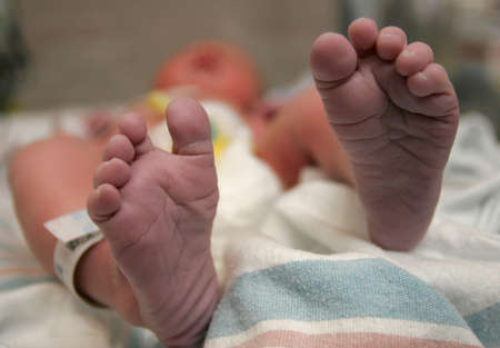 Newborn moving his little feetの写真素材