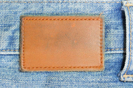 Blank lather label on blue jeansの写真素材