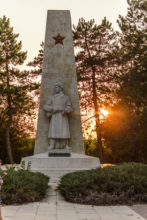 VARNA, BULGARIA, August 30 2015, Alyosha Monument at sunset between tree , Dobrich, Bulgariaのeditorial素材