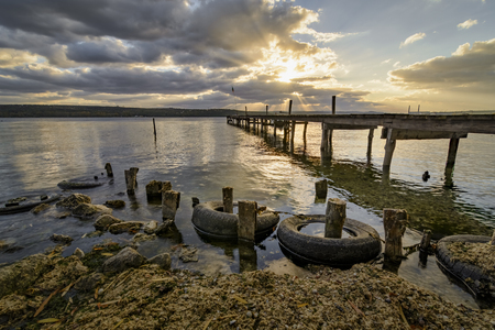 wooden pier  with old tires on it , kazashko village , Bulgariaの写真素材