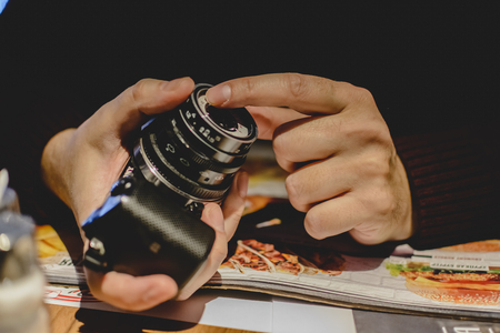 Unknown person holding a Camera with a vintage lensの写真素材