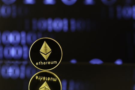 Ethereum with reflexion Against blurry background.