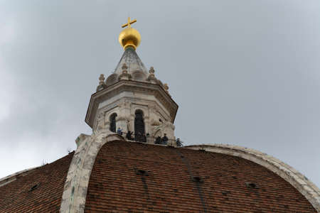Firenze, Italy, April 26, 2019: Tourist on the top of the cathedral Le Duomo, Santa Maria del Fiore visiting and taking panoramic photosのeditorial素材