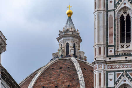 Firenze, Italy, April 26, 2019: Tourist on the top of the cathedral Le Duomo, Santa Maria del Fiore visiting and taking panoramic photosのeditorial素材