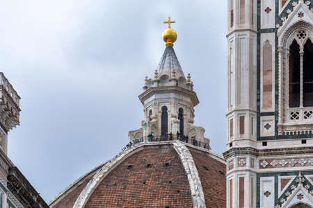 Firenze, Italy, April 26, 2019: Tourist on the top of the cathedral Le Duomo, Santa Maria del Fiore visiting and taking panoramic photosのeditorial素材