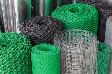 Rolls of plastice and steel wire mesh in various sizes and patternsの写真素材