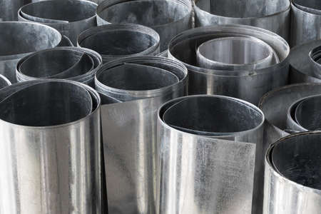 Rolls of flat galvanized metal sheets, building materialの写真素材