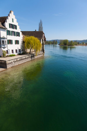 View of river in Stein am Rhein, Switzerland in a sunny clear blue sky dayのeditorial素材