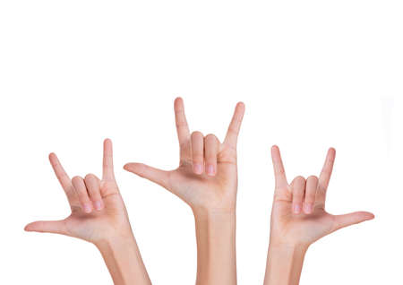 Three hands with fingers forming love sign, isolated white background with copy space on topの写真素材