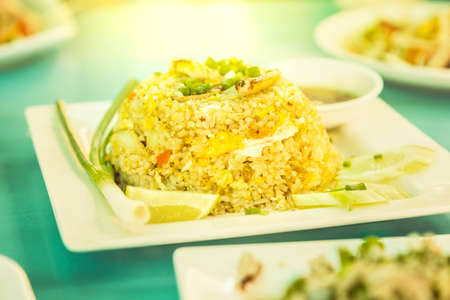 Crab fried rice, Thai food, with vintage color style effect, selective focus in the center part of the frame with blur foreground and backgroundの写真素材