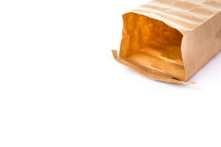 laid opened paper brown bag isolated on white with room for copy spaceの写真素材