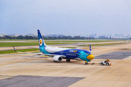 Bangkok, Thailand - 14 September 2017 - Nokair technicians on push car push out the aircraft to...