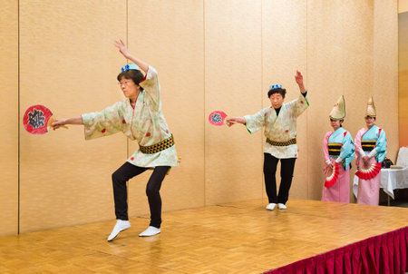 Hokkaido, Japan - 28 December 2017 - Japanese local performers in traditional Japanese dress perform traditional local Japanese style dance for hotel guests at Eclipse hotel in Hokkaido, Japan on December 28, 2017のeditorial素材