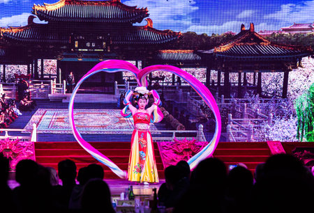Xian, China - 6 March 2018 - Beautiful female Chinese dancer show her perfect skill dance during the Tang Dynasty Dance Show at a restaurant in Xian, China on March 6, 2018のeditorial素材