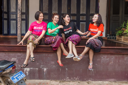 Luang Prabang, Laos - 30 June 2018 -  Female Asian tourists enjoy each other company while having fun conversation in Luang Prabang, Laos on June 30, 2018のeditorial素材