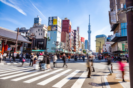Asakusa, Japan - 24 February 2019 - Road traffic and pedestrians walk across streets in front of Asakusa temple in Japan on February 24, 2019のeditorial素材