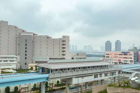Odaiba, Japan - 11 April 2019 - Odaiba monorail trains stop at a station to send and pick up...