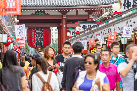 Asakusa, Japan - 13 June 2015 - Tourists and visitors walk around in front of the famous Asakusa temple entrance on June 13, 2015のeditorial素材