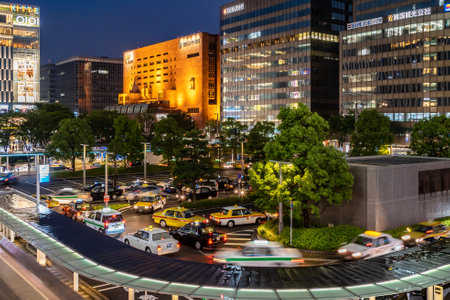 Fukuoka, Japan - 13 July 2019 - Taxis and cars come to pick up and drop off passengers at Hakata station on July 13, 2019 night in Fukuoka, Japanのeditorial素材