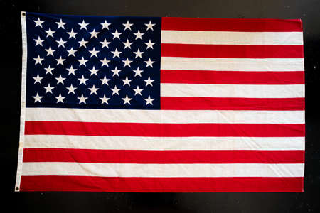USA flag on black concrete background, flatlay