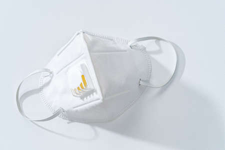 White N95 mask on white table, health conceptの写真素材
