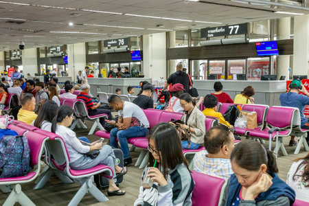 Bangkok, Thailand - 14 July 2019 - Travellers wait  to get on their flight at Don Muang International Airport, Thailand on July 14, 2019のeditorial素材
