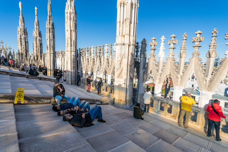 Milan, Italy - 23 December 2019 - Tourists hang out on the roof top of the famous Milan's church, Duomo Cathedral, on December 23, 2019のeditorial素材
