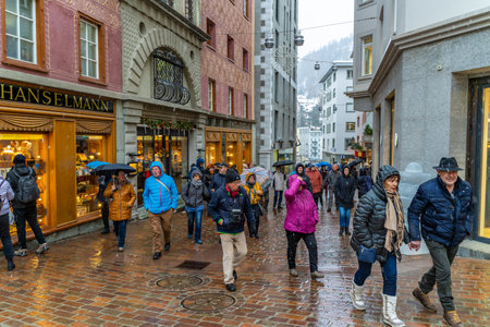 St. Moritz, Switzerland - 20 December 2019 - Tourists walk around downtown of St. Moritz, Swtizerland during snow fall of December 20, 2019のeditorial素材