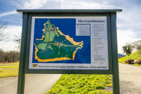 Frauenchimsee, Germany - 15 December 2021 - Map of Frauenchimsee island displays on wooded board, shows the location of Herrenchiemsee Palaceのeditorial素材