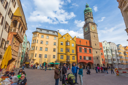 Innsbruck, Austria, 11 April 2015 - People hang out around the famous old town surrounded by old Tyrolese architectureのeditorial素材