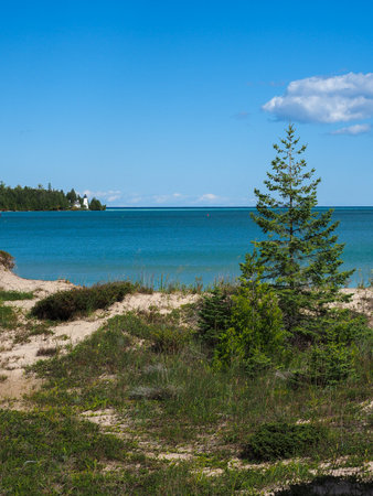 Vertical image of Presque bay and the Old Presque Isle lighthouse in Northern Michiganの写真素材