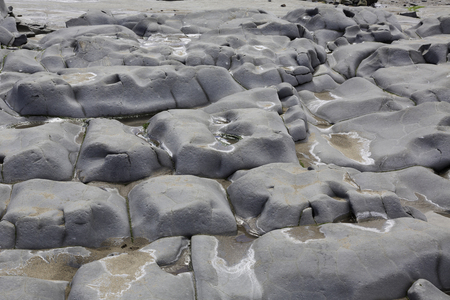 Doniford Bay consists of the Lower Jurassic Lias, and Triassic beds.The Jurassic lias at Doniford are the youngest of the lias at Somerset and marks the uppermost beds of the Lower lias. Horizons of the Doniford Shale's can be located and at low tide, neaの写真素材