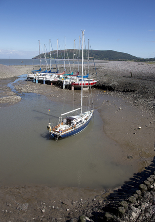 Boat moored in a small harbour in the south west of the UKの写真素材