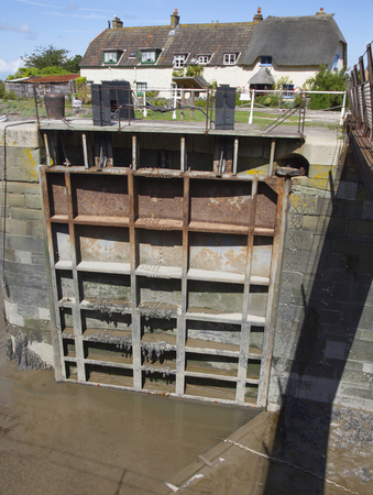 A lock gate at the pretty harbour at Porlock Weir in Somersetの写真素材